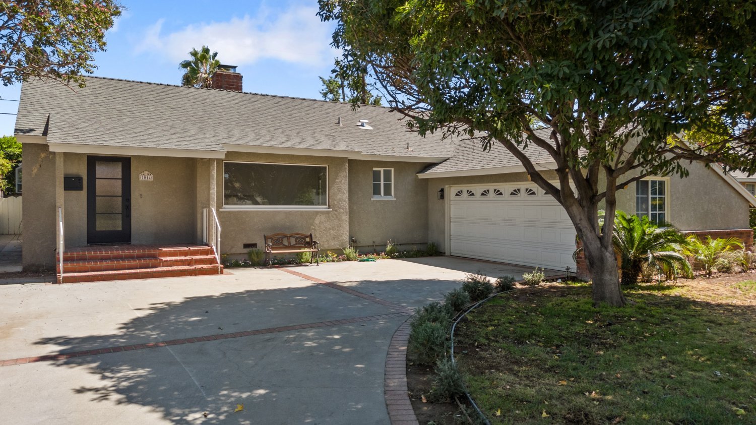 exterior daylight shot of 7014 colbath ave home for sale in Los Angeles California