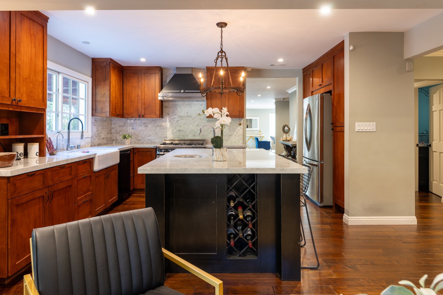 modern kitchen with wooden cabinetsand white marble countertops in studio city california 